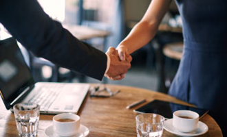 A man and woman shaking hands